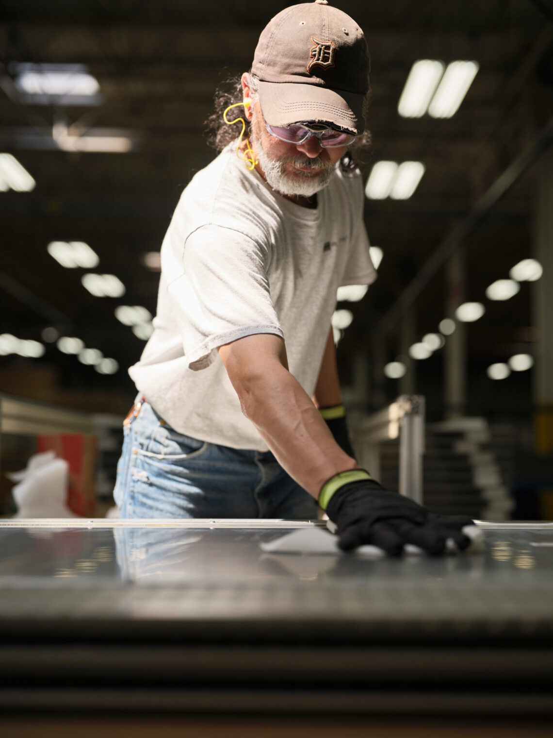 Shop Employee Cleaning a honeycomb panel