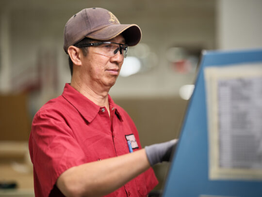 Shop Employee using CNC
